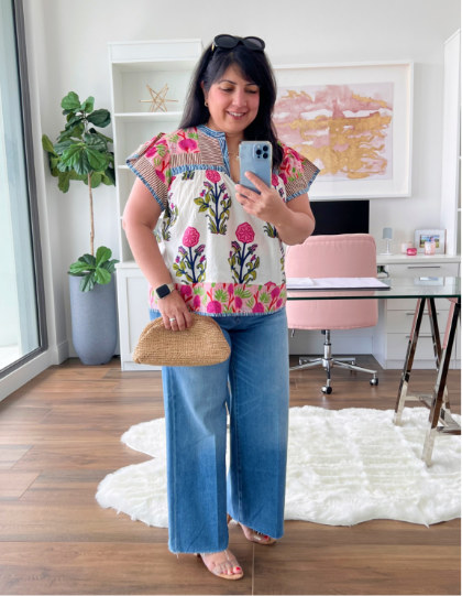 anita in jeans and floral blouse